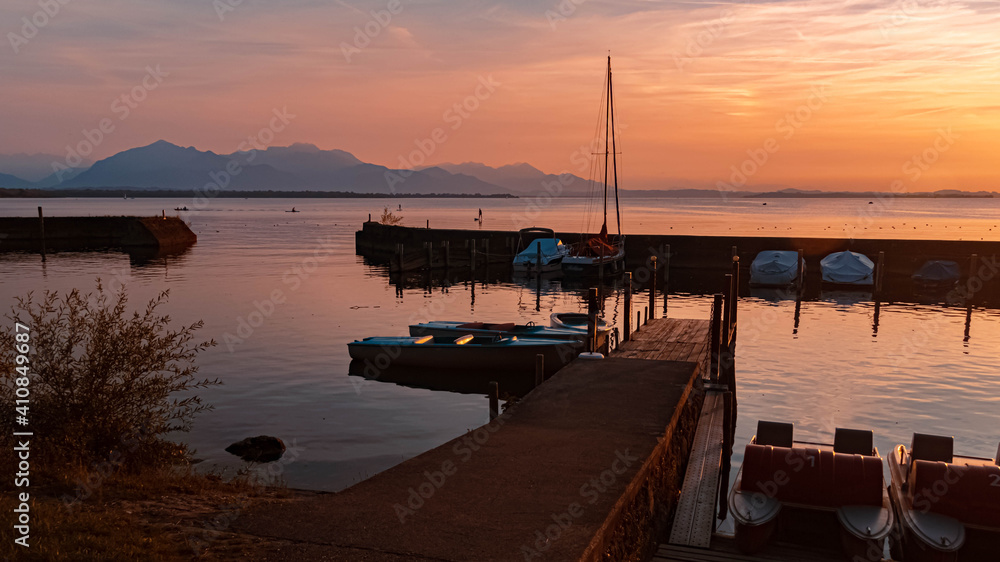 Beautiful sunset with reflections at the famous Chiemsee, Chieming, Bavaria, Germany