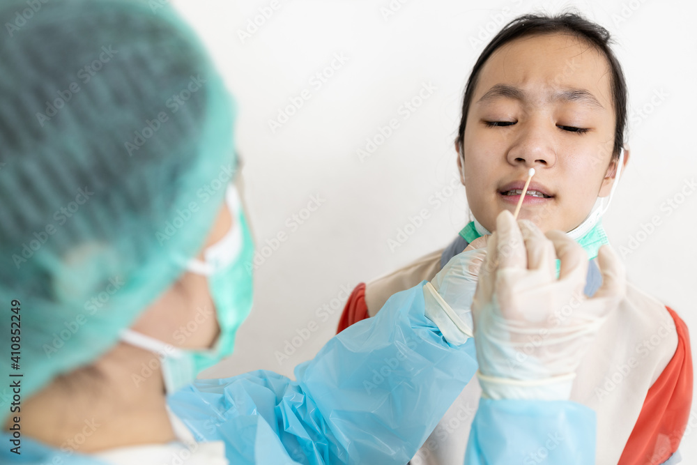 Check point for Coronavirus,Examining nasal mucus test from child girl,taking a swab inserted into the nostril,health check,physical exam for diagnosis of COVID-19,service and testing in the hospital. Check point for Coronavirus,Examining nasal mucus test from child girl,taking a swab inserted into the nostril,health check,physical exam for diagnosis of COVID-19,service and testing in the hospital.