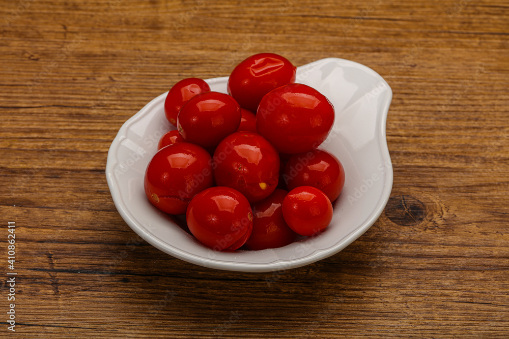 Pickled cherry tomatoes in the bowl Pickled cherry tomatoes in the bowl