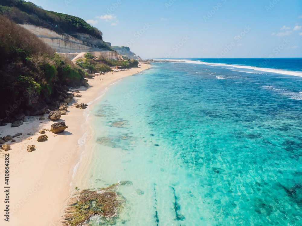 Aerial view of tropical beach with turquoise ocean in Bali