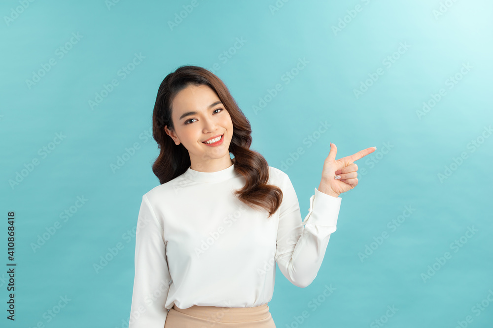 Friendly-looking female student showing you way, pointing fingers up at promo banner, Friendly-looking female student showing you way, pointing fingers up at promo banner,