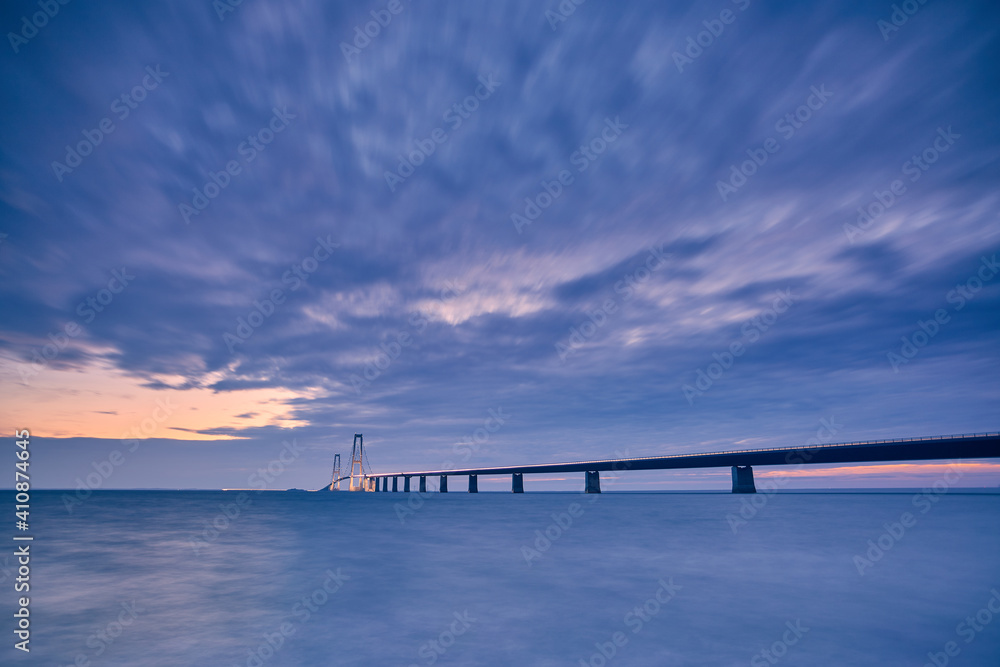 a bridge at night with beautiful blue sunset