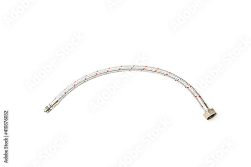 Cable metal hose on white background for supplies Water heater. Close-up.