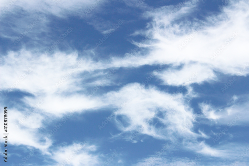 Bright blue sky with white clouds