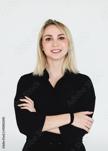 Portrait of a cute and charming woman in black shirt pose to camera with self confident on white background