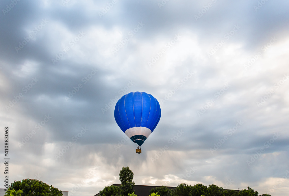 Hot air balloon over the blue sky over Igualada, Spain