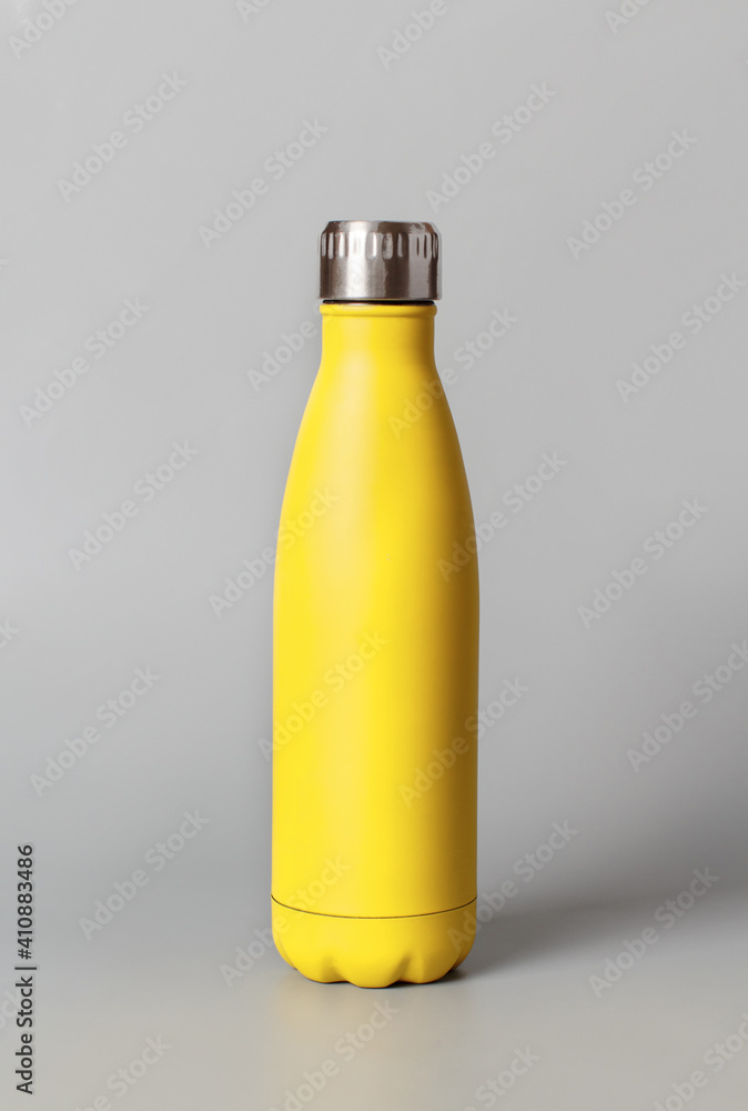 Yellow reusable bottle on yellow background Yellow reusable bottle on yellow background