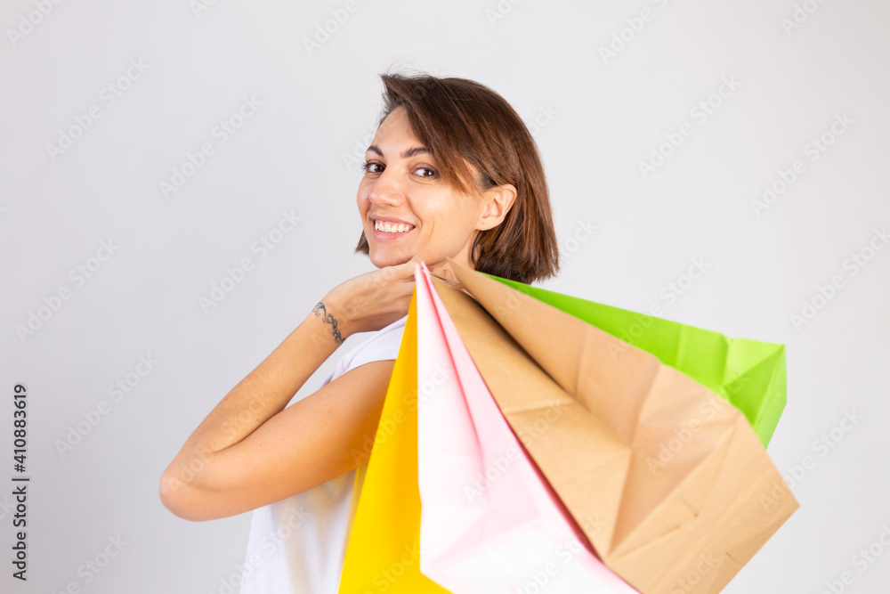 Studio photo of european woman with shopping bags on white background Studio photo of european woman with shopping bags on white background