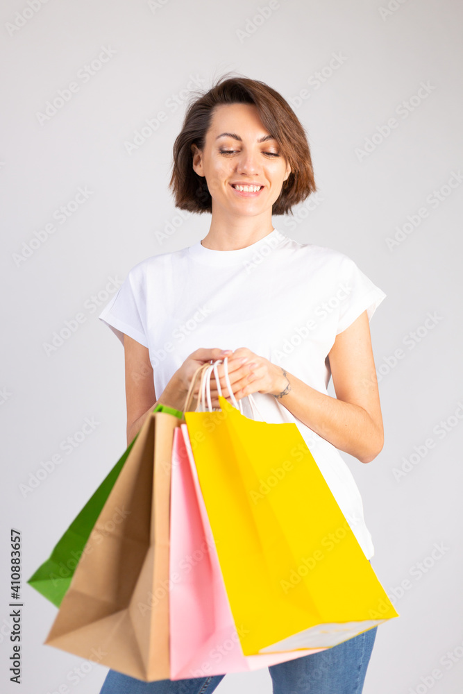 Studio photo of european woman with shopping bags on white background Studio photo of european woman with shopping bags on white background