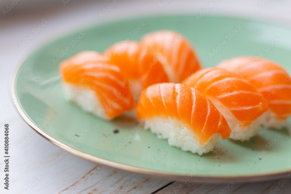 Sushi on a ceramic plate, rice and salmon Sushi on a ceramic plate, rice and salmon