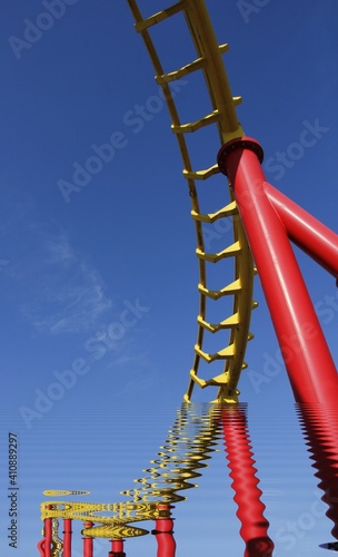 vivid red roller coaster on clear cloudless blue sky background structural 3D illustration design concept 