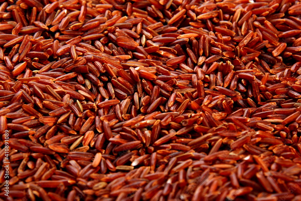 raw red rice background. uncooked brown wild rice, top view