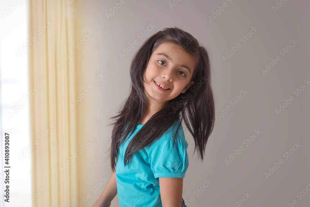 portrait of a young girl smiling 	