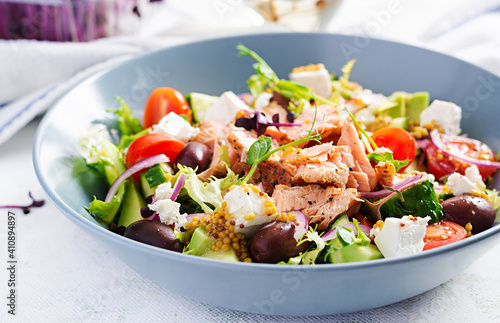 Ketogenic lunch. Greek salad with grilled salmon. Healthy dinner. Keto, paleo diet.