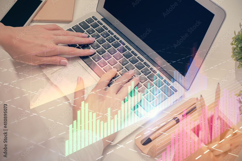 Multi exposure of woman hands typing on computer and forex chart hologram drawing. Stock market analysis concept. Multi exposure of woman hands typing on computer and forex chart hologram drawing. Stock market analysis concept.