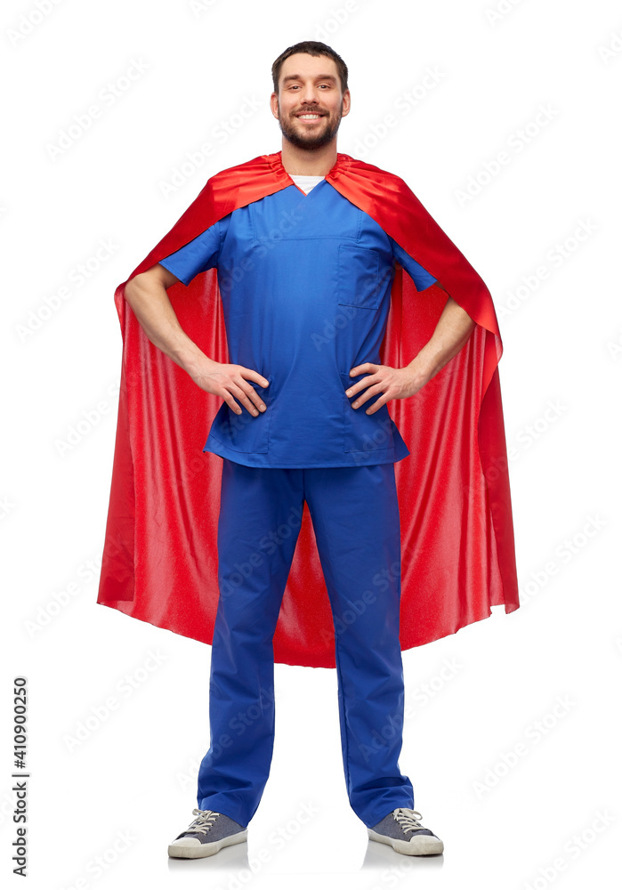 healthcare, profession and medicine concept - happy smiling doctor or male nurse in blue uniform and red superhero cape over white background healthcare, profession and medicine concept - happy smiling doctor or male nurse in blue uniform and red superhero cape over white background