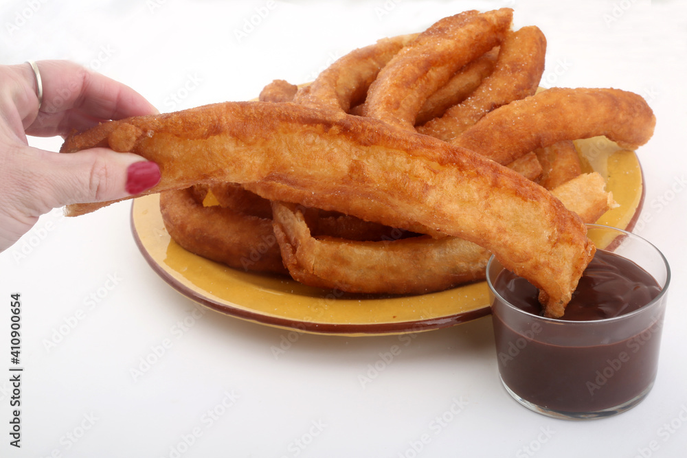 fried sugar bars with hot chocolate as typical spanish snack fried sugar bars with hot chocolate as typical spanish snack