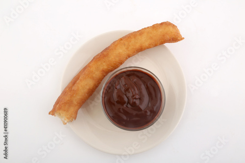 fried sugar bars with hot chocolate as typical spanish snack