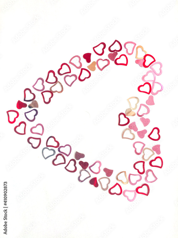 Many small beautiful shiny hearts forms big heart on white background. Lovely valentine day, 14th February. Feeling in love. Happy wedding and blissful life. Feel catch and grab by love