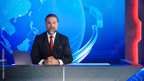 Live News Studio with Professional Male Newscaster Reporting on the Events of the Day. Broadcasting Channel with Presenter, Anchor Talking. Mock-up TV Newsroom Set with News Ticker.