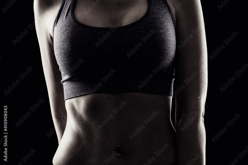 Slim beauty athletic woman on black background - obrazy, fototapety, plakaty 