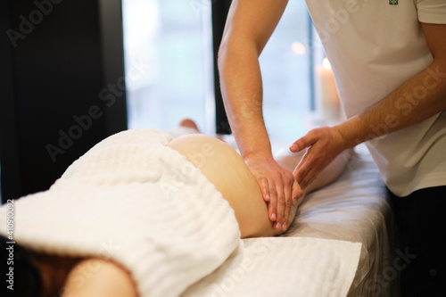 masseur makes anticellulite massage young woman in the spa salon. Body care concept. Special anticellulite treatment.