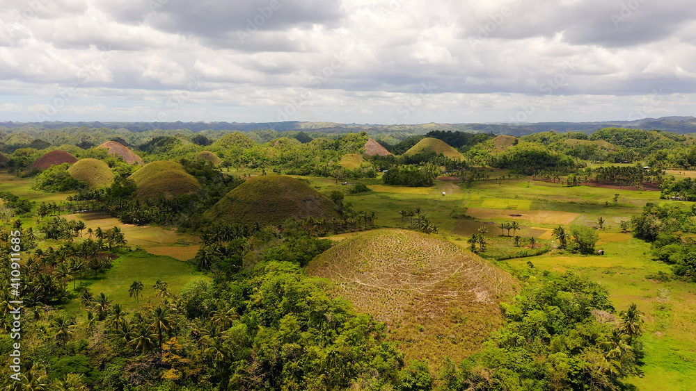 Chocolate Hills - one of the main attractions of the island of Bohol. Summer landscape in the Philippines.
