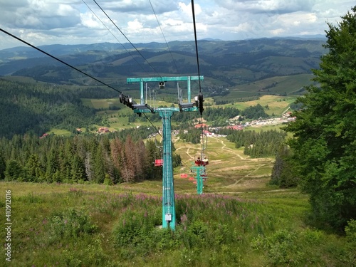 a lift at high altitude transports people in the mountains