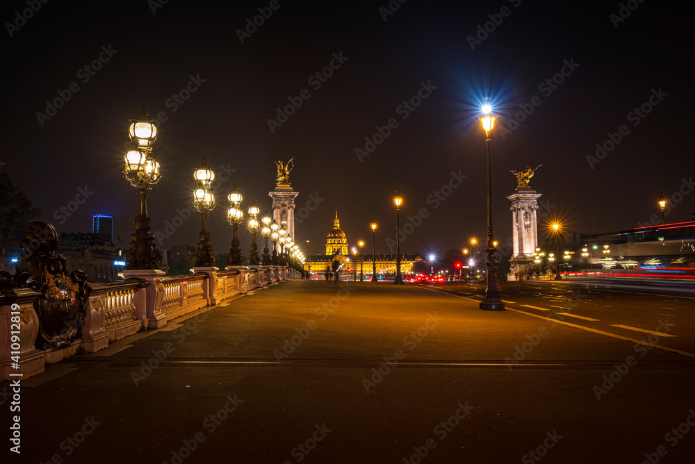 A night view on the Hotel national des Invalides from the The Pont Alexandre III in Paris