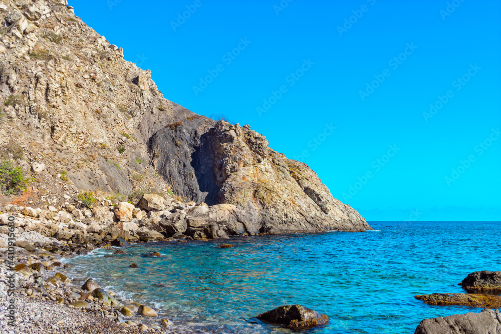 beautiful sea bay among the rocks on a sunny summer day