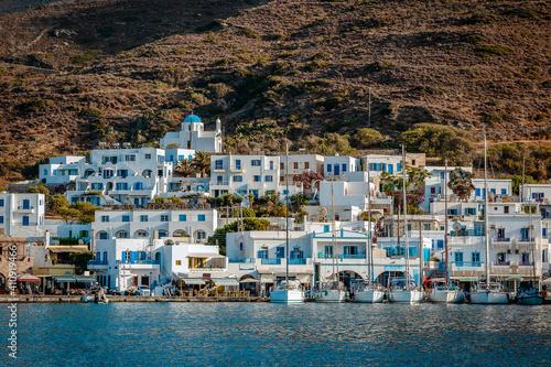 Yachts peacefully moored up along the quay in the Greek sunshine on Amorgos.