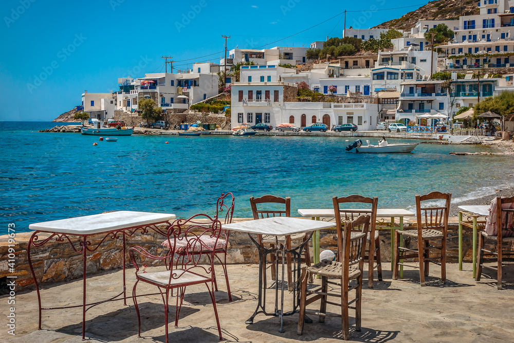 View accross the local cafe terrace to the waterfront at Amorgos, Greece View accross the local cafe terrace to the waterfront at Amorgos, Greece