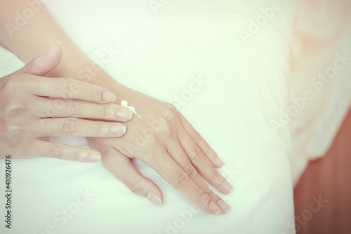 Fototapeta Naklejka Na Ścianę i Meble -  beautiful woman hands with cream