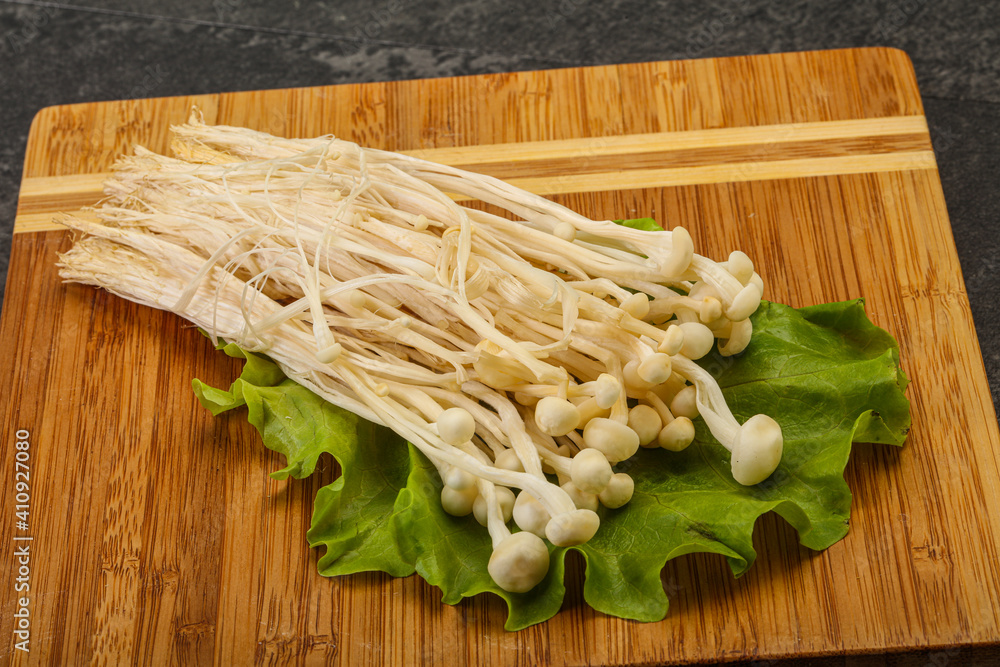 Raw Enoki mushrooms for cooking