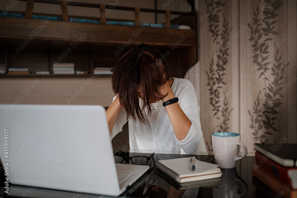 Upset asian woman working from home office. Upset asian woman working from home office.
