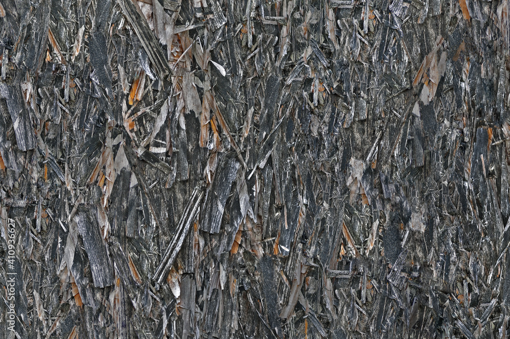 Old aged weathered oriented strand board OSB chipboard texture, grungy grey vertical pattern, horizontal rustic macro closeup, large detailed dark textured grunge ruined wooden background copy space Old aged weathered oriented strand board OSB chipboard texture, grungy grey vertical pattern, horizontal rustic macro closeup, large detailed dark textured grunge ruined wooden background copy space