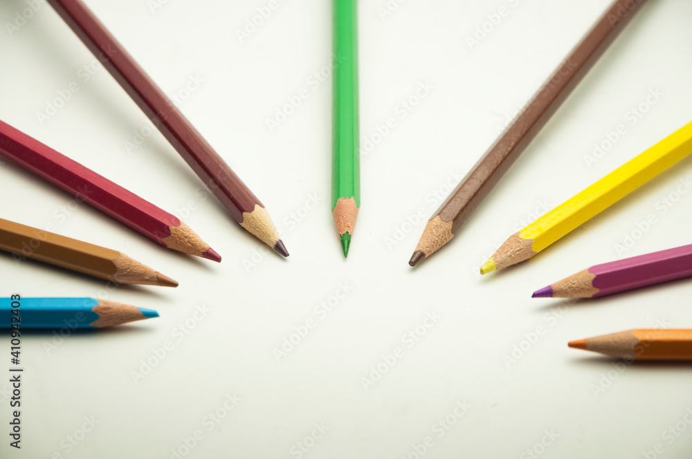 colored pencils on a white background. education concept. illustration of training.