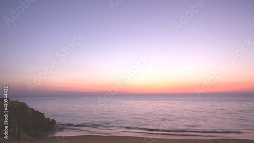 photography of sunset sky  abstract golden yellow sky  sunrise morning over clouds. skies covered colorful light rays shine through clouds. sunbeam flare spreading on beautiful nature dawnlight.