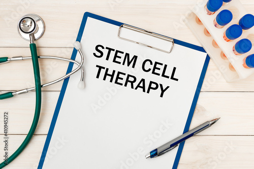 Wallpaper Mural Paper with STEM CELL THERAPY on a table, stethoscope and pen Torontodigital.ca