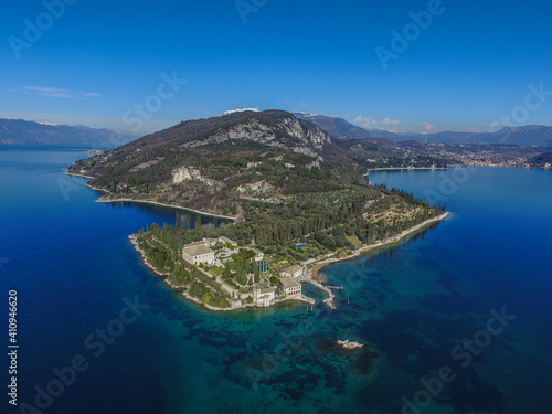 Fototapeta Naklejka Na Ścianę i Meble -  Baia delle Sirene, Punta San Vigilio - Garda Lake, Italy. Beautiful view on lake, italian summer view aerial by Drone