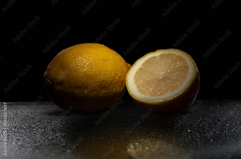 Sliced lemon on black background