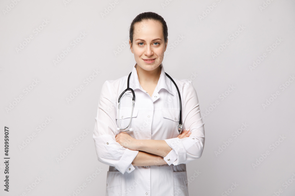Young nurse looking at the camera on white isolated background. Corona Virus Pandemic concept Young nurse looking at the camera on white isolated background. Corona Virus Pandemic concept