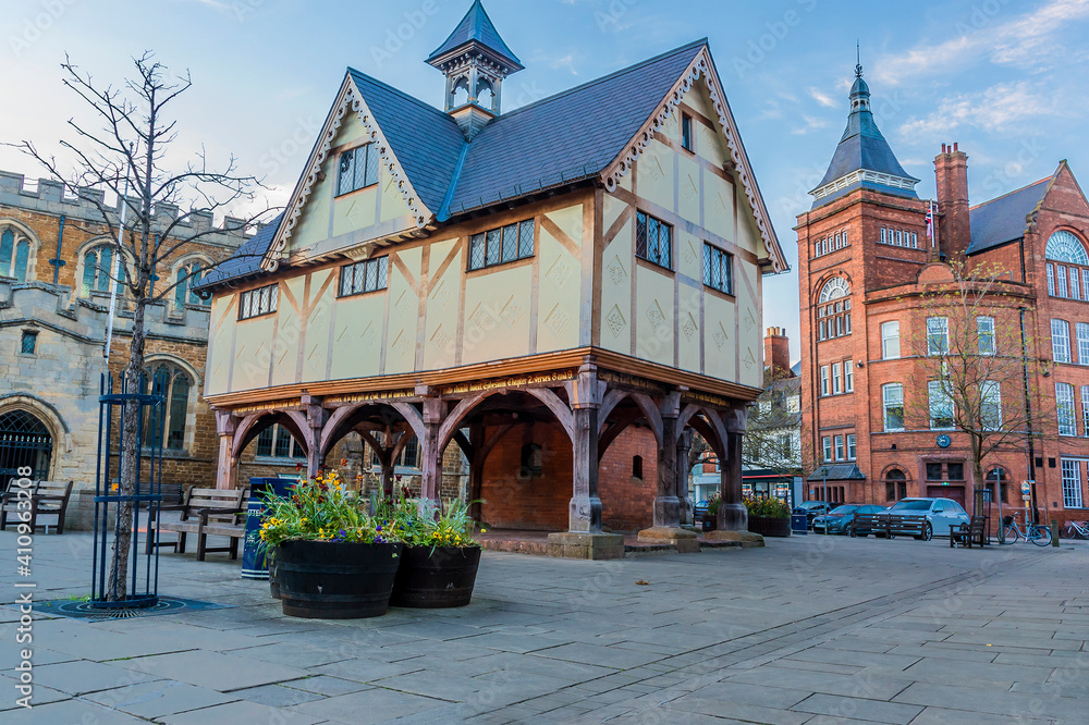 A view across the old church square in Market Harborough, UK towards Adam and Eve Street on a spring evening