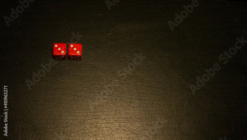 Dice combination on a black wooden surface