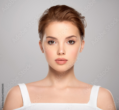 Beautiful face of young caucasian woman with perfect healthy skin, isolated. Pretty white model caring of face. Beauty treatment concept. Skin care concept.