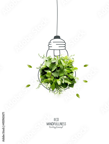 Energy saving eco lamp, made with green sprout and leaves,isolated on white background. LED lamp with green leaf. Minimal nature concept.Think Green.Ecology Concept. Environmentally friendly planet.