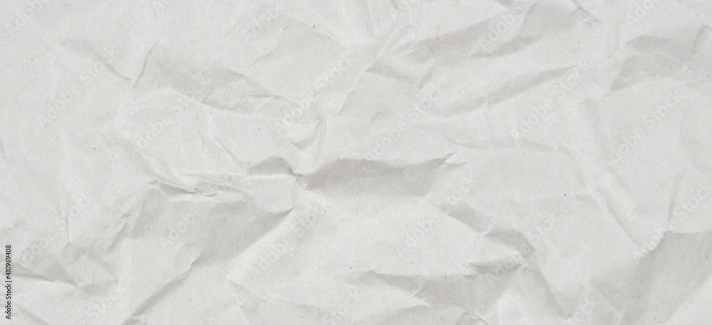 Light gray crumpled wrapping paper texture background, top view Light gray crumpled wrapping paper texture background, top view