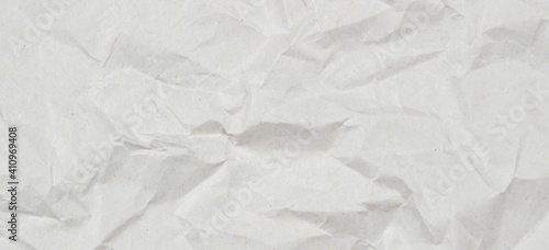 Light gray crumpled wrapping paper texture background, top view