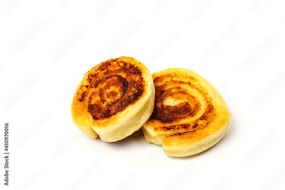 Fototapeta premium Two fried alupatras isolated on white . Potato rolls in dough