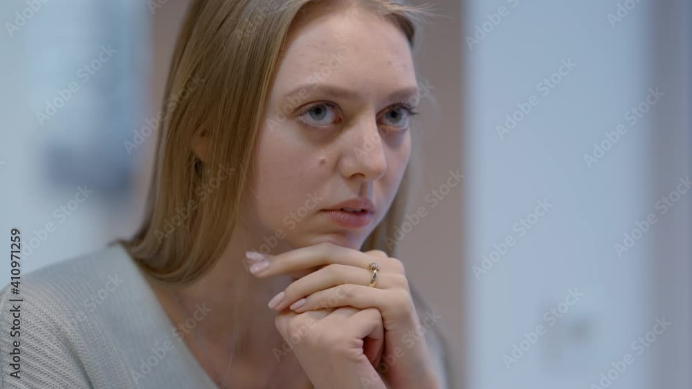 Close-up of depressed young Caucasian woman touching head with hands. Portrait of frustrated desperate lonely lady thinking indoors. Depression and hopelessness concept. Close-up of depressed young Caucasian woman touching head with hands. Portrait of frustrated desperate lonely lady thinking indoors. Depression and hopelessness concept.